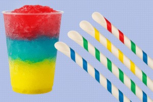 Colorful slushie with striped spoon straws